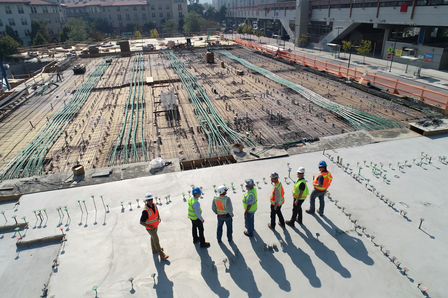 Construction team on a reinforced concrete building site (illustrative stock photo)